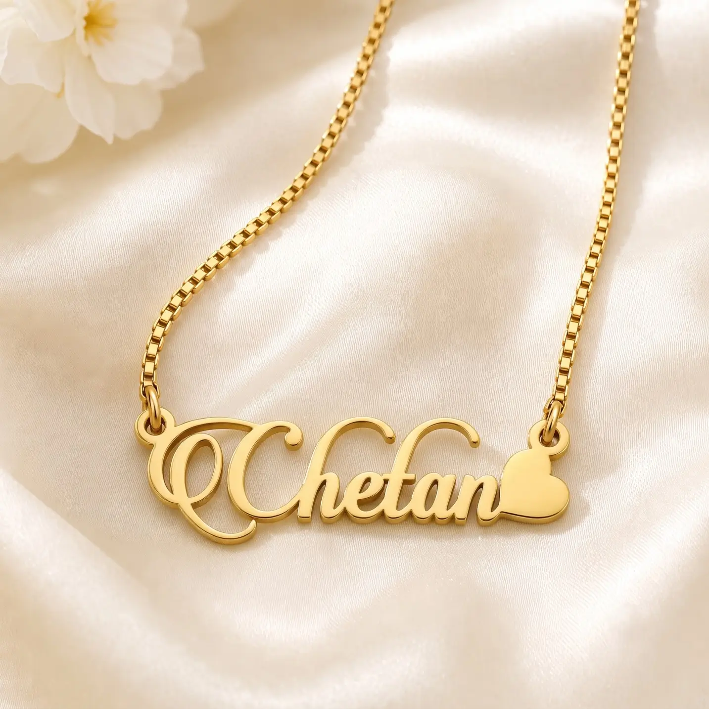 Stylish Heart Name Necklace - Satin Detail Gold-tone decorative script name necklace with a heart on ivory satin