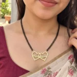 Double Heart Couple Name Necklace with a black-beaded chain worn with a sari