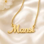 Gold-tone simple script name necklace on ivory satin