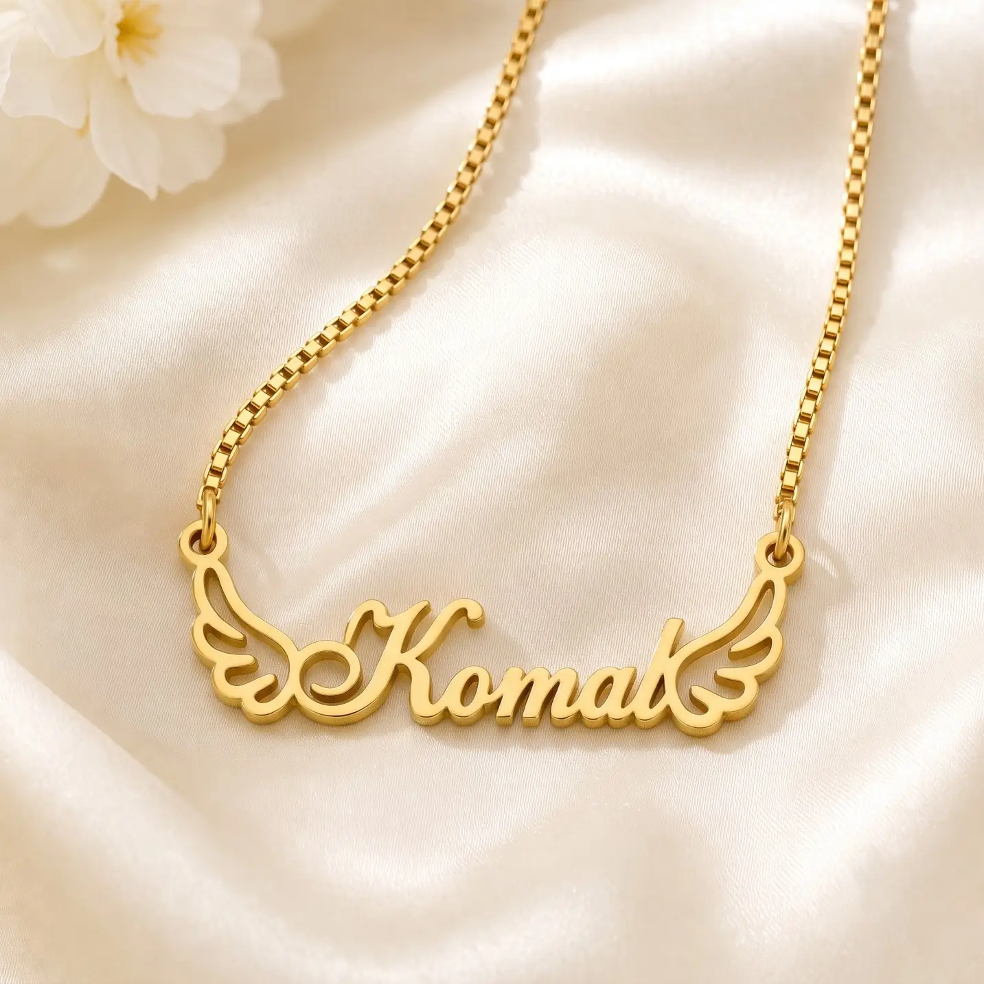 Angel Wings Name Necklace - Satin Detail Gold-tone angel wings name necklace on ivory satin