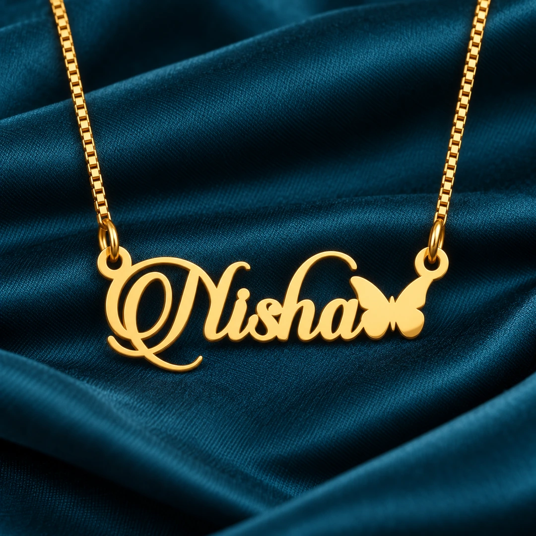Butterfly Style Name Necklace - Reshoot 5 Gold Nisha ornate script name pendant with butterfly and golden box chain, teal satin product view