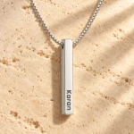 Personalized Silver Finish 3D Bar Pendant on a rough stone surface