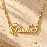 Crown, Star and Heart Name Necklace on a rough stone surface