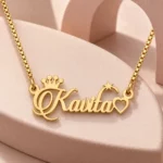 Crown, Star and Heart Name Necklace on a pink display
