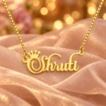 Crown Name Necklace with original gold box chain on blush organza background