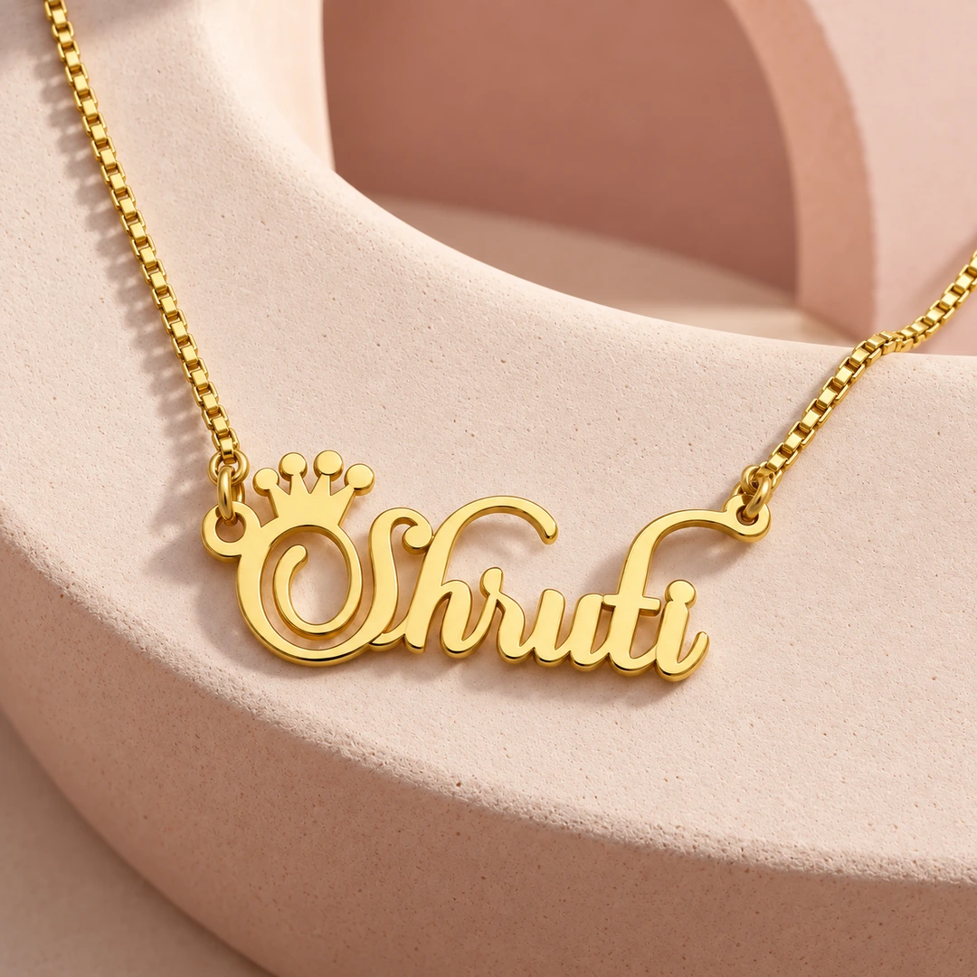 Crown Name Necklace - Ceramic Detail Crown Name Necklace with original gold box chain on ceramic detail background