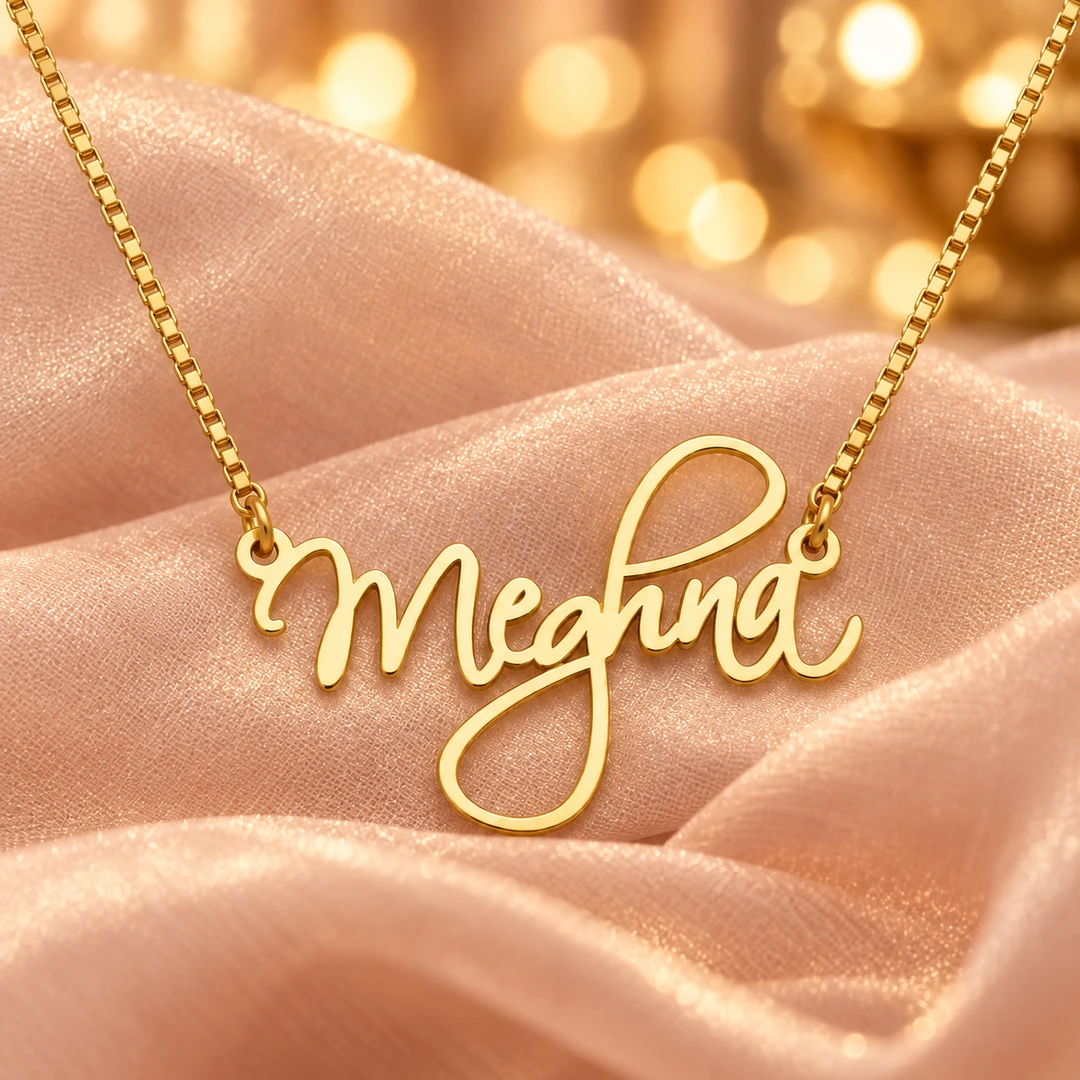 Cursive Curved Name Necklace - Blush Organza Cursive Curved Name Necklace with original gold box chain on blush organza background