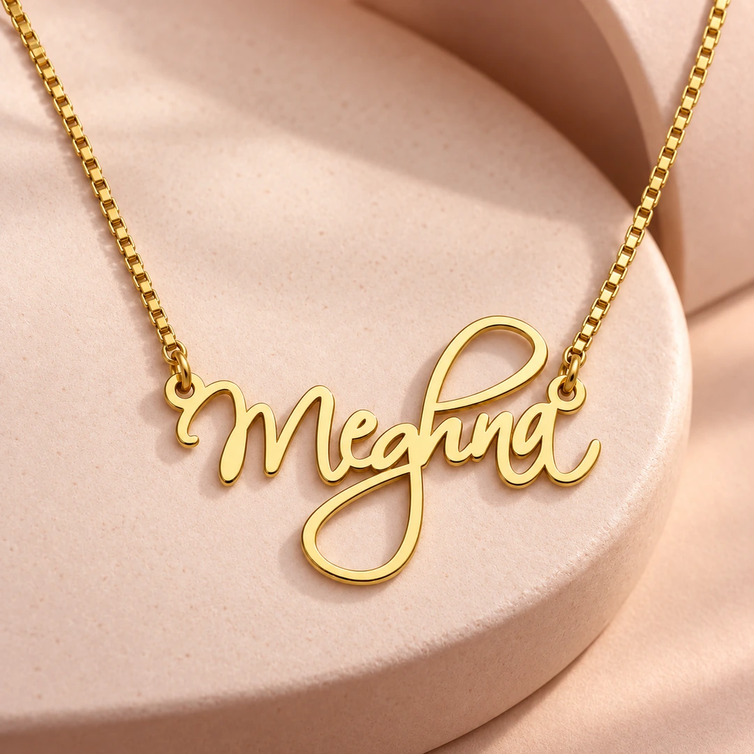 Cursive Curved Name Necklace - Ceramic Detail Cursive Curved Name Necklace with original gold box chain on ceramic detail background