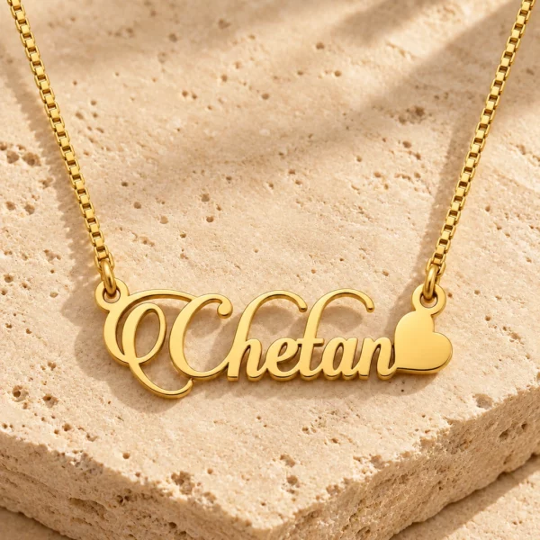 Candlescript Heart Style Name Necklace gold pendant with original box chain on travertine hero setting