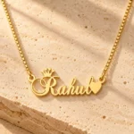 Crown With Heart Name Necklace gold pendant with original box chain on travertine hero setting