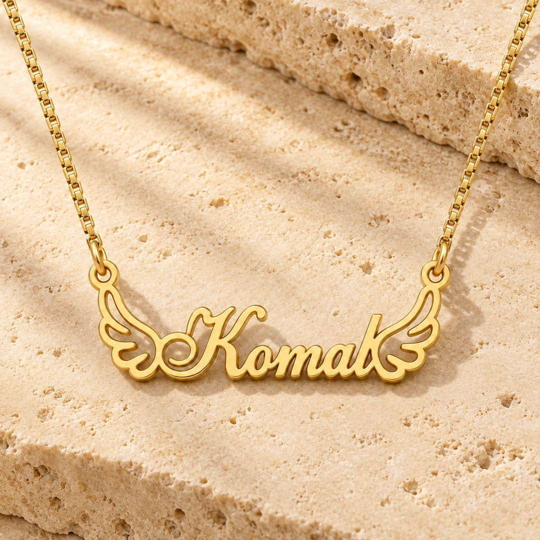 Angel Wings Name Necklace - On a rough stone surface Angel Wings Name Necklace on a rough stone surface