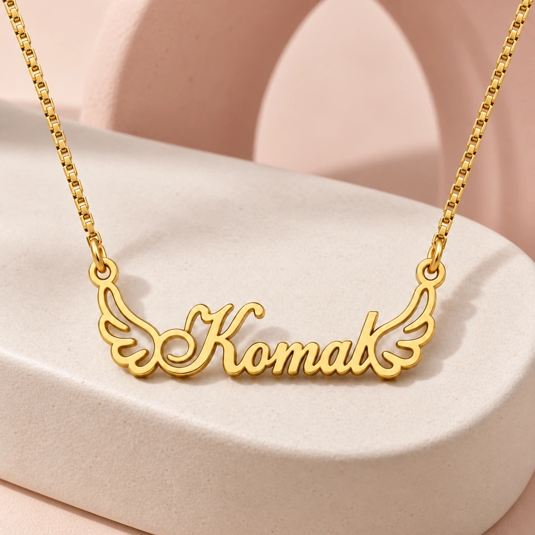 Angel Wings Name Necklace - On a pink display Angel Wings Name Necklace on a pink display