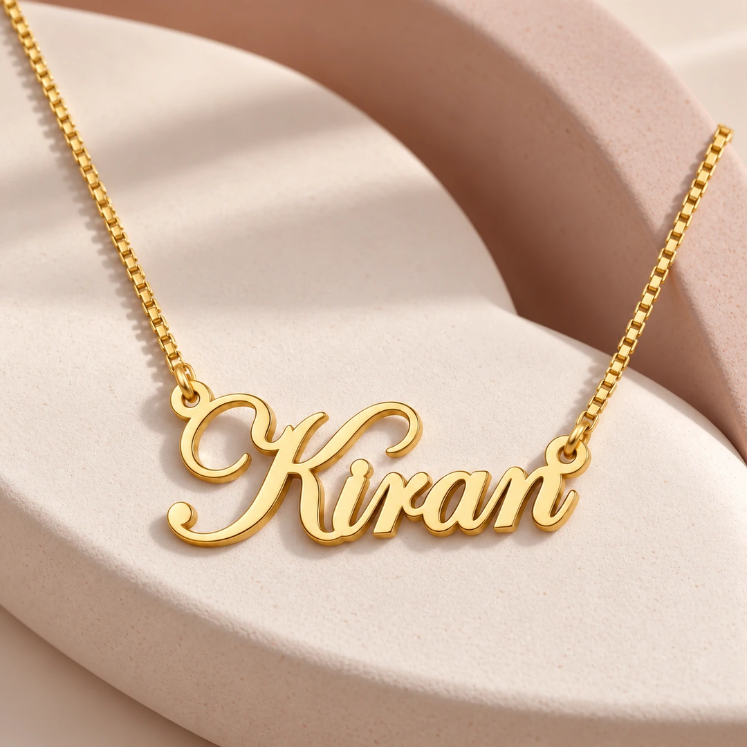 Stylish Name Pendant — Ceramic concept Gold Kiran stylish name pendant and box chain on curved ceramic