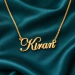 Gold Kiran stylish name pendant with ornate capital K and original box chain, teal setting
