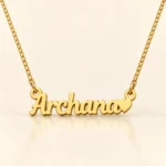 Gold Archana name pendant with solid heart and original box chain, ivory setting