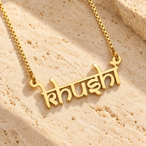 Indian Style Name Necklace on a rough stone surface