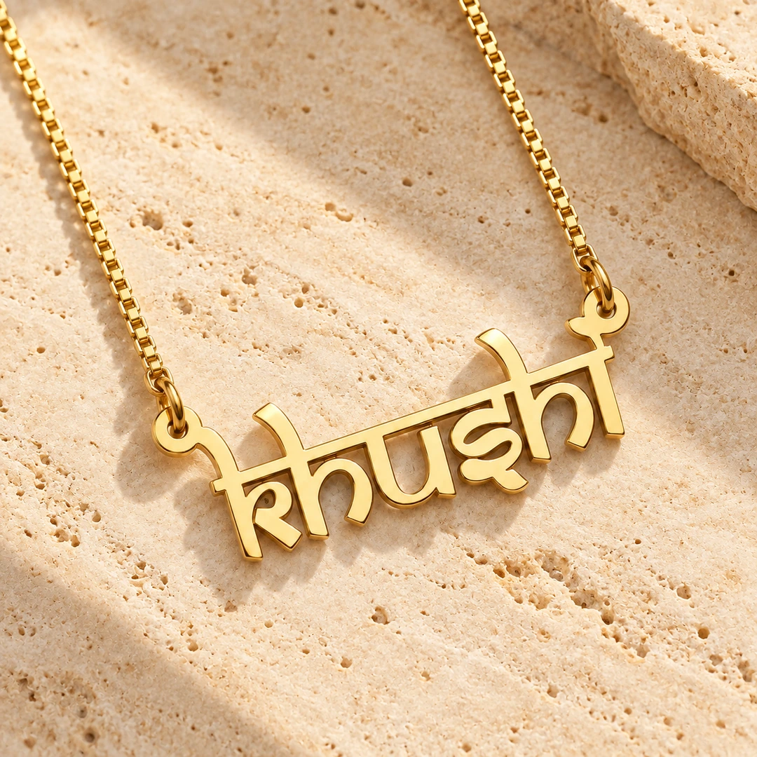 Indian Style Name Necklace - On a rough stone surface Indian Style Name Necklace on a rough stone surface