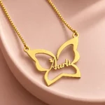 Butterfly Custom Name Necklace necklace on rose ceramic surface