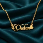 Stylish Heart Name Necklace on dark green fabric