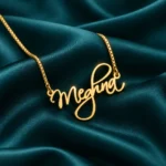 Gold cursive Meghna name necklace with box chain - Teal Satin