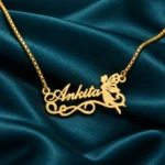 Fairy Angel Name Pendant on dark green fabric