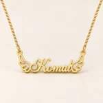 Angel Wings Name Necklace on an cream background