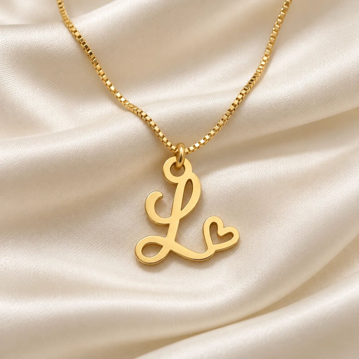 Curved Heart Letter Pendant - With a chain on cream fabric Curved Heart Letter Pendant with a chain on cream fabric