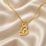 Gold B letter pendant with integrated heart cutout and fine box chain, satin