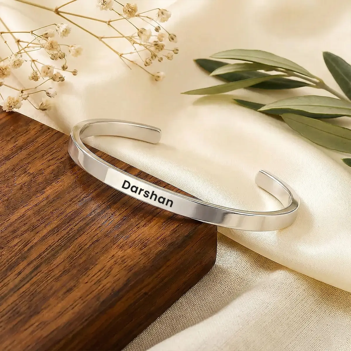 Personalized Silver Finish Adjustable Name Kada - On a light display cushion Personalized Silver Finish Adjustable Name Kada on a light display cushion