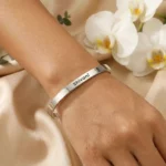 Personalized Silver Finish Adjustable Name Kada shown on a wrist from another angle