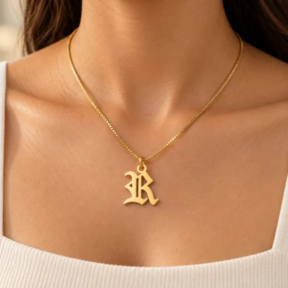Old English Letter Pendant worn on a fine chain
