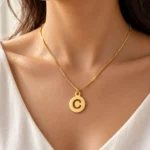 Round Letter Pendant worn on a fine chain