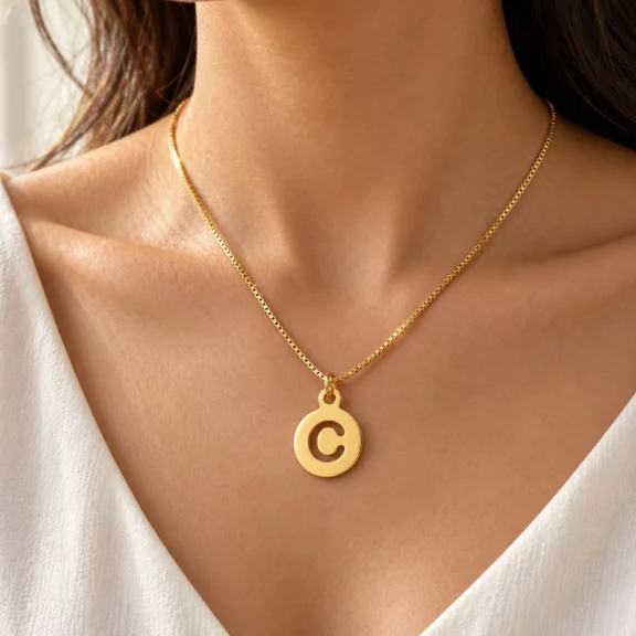 Round Letter Pendant worn on a fine chain