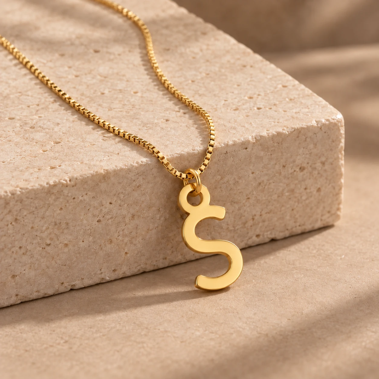 Simple Letter Pendant - With a chain on a stone display Simple Letter Pendant with a chain on a stone display