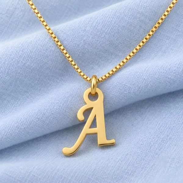 Stylish Letter Pendant displayed on pale blue fabric