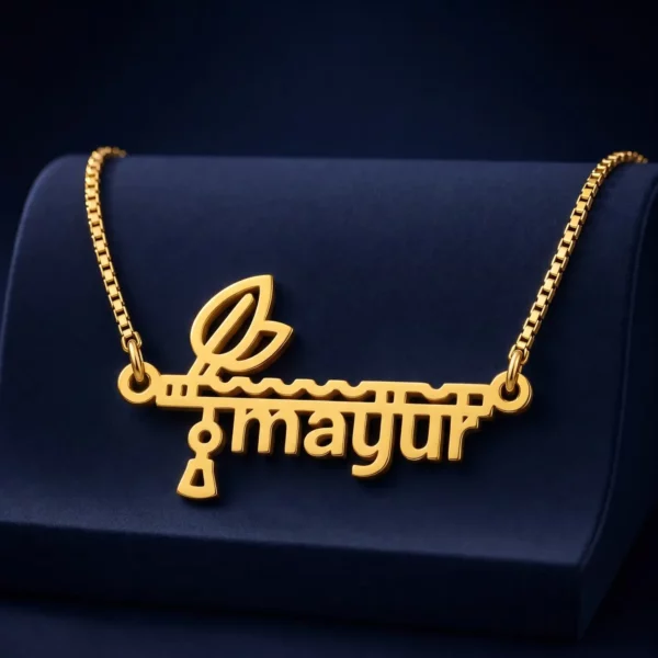 Gold-tone flute and feather name pendant on a navy velvet display