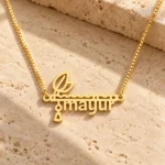 Flute and Feather Name Pendant on a rough stone surface