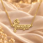 Flute and Feather Name Pendant on peach fabric