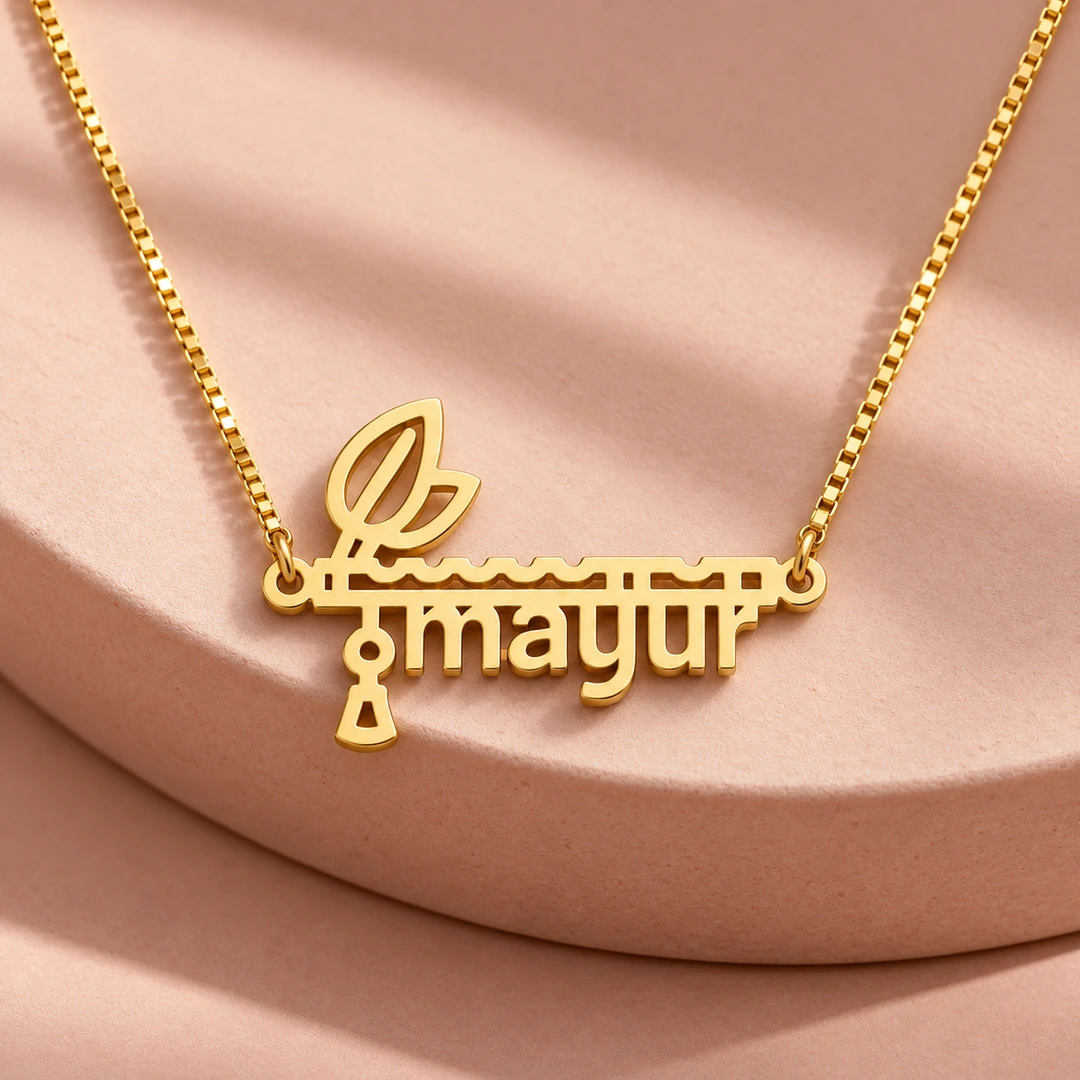 Flute and Feather Name Pendant - On a pink display Flute and Feather Name Pendant on a pink display