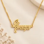Flute and Feather Name Pendant on an cream background