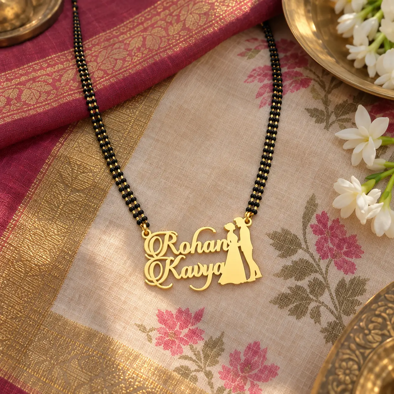 Couple Design Name Necklace - With a black-beaded chain on floral fabric Couple Design Name Necklace with a black-beaded chain on floral fabric