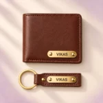 Top view of brown wallet and matching keychain with VIKAS name plates