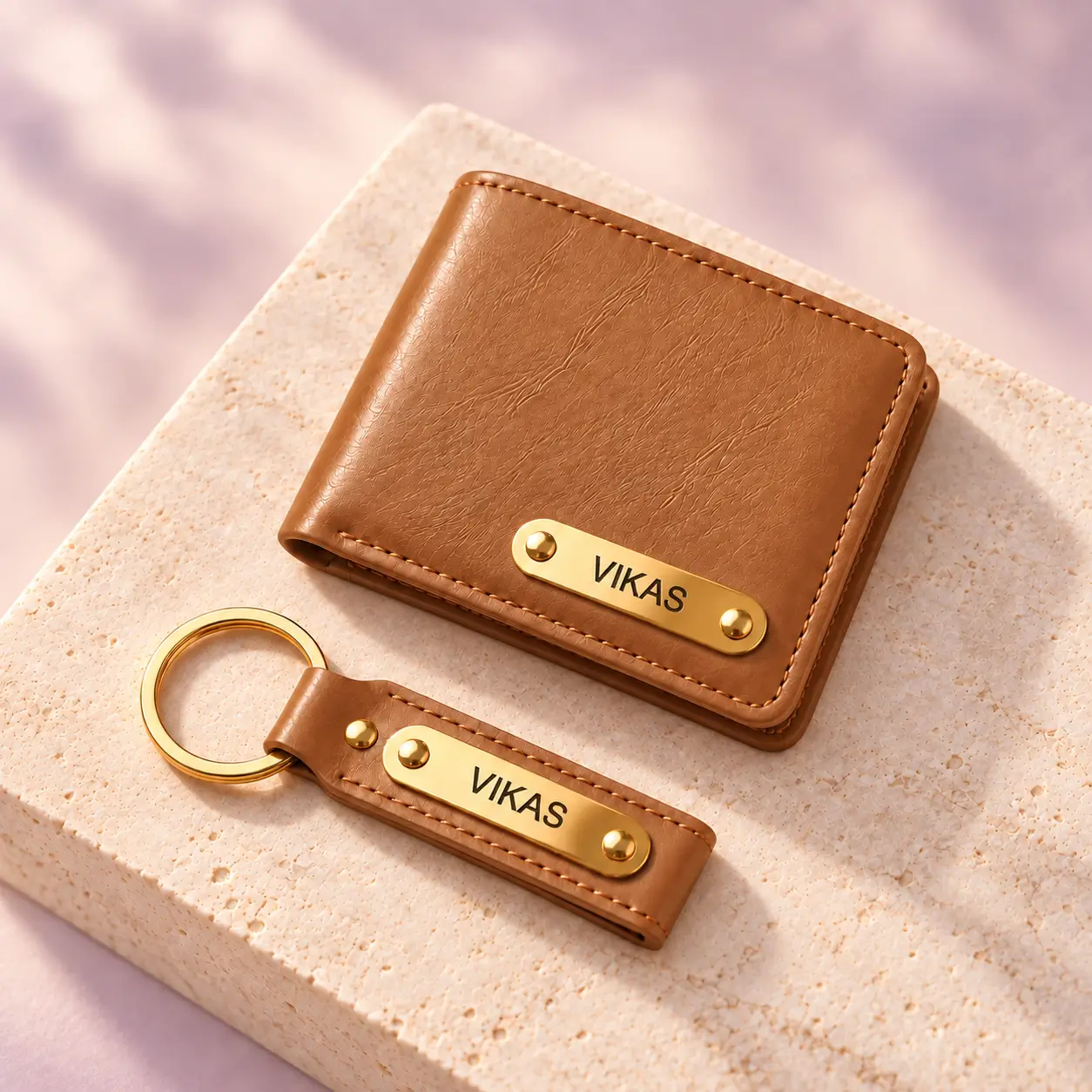 Tan Wallet and Keychain Combo - 4 Personalized tan wallet and keychain displayed on a light stone surface