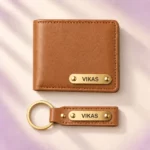 Top view of tan wallet and matching keychain with VIKAS name plates