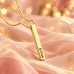 Gold Plated Personalized 3D Bar Pendant necklace on blush organza surface
