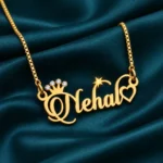 Sparkle Crown Name Necklace on dark green fabric