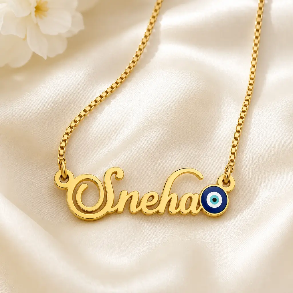 Blue Evil Eye Name Necklace - Satin Detail Gold-tone name necklace with a blue evil eye accent on ivory satin