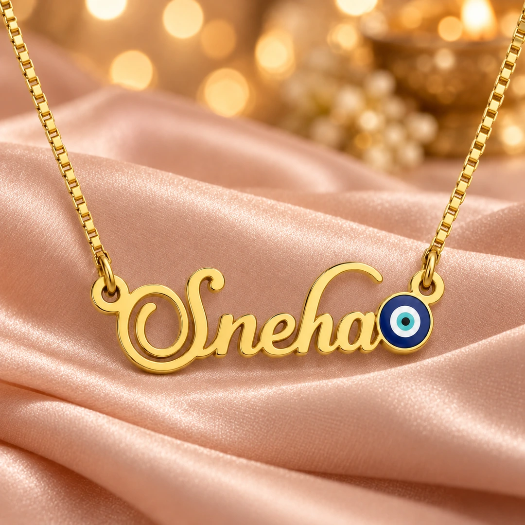 Blue Evil Eye Name Necklace - On peach fabric Blue Evil Eye Name Necklace on peach fabric