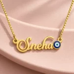 Blue Evil Eye Name Necklace on a pink display