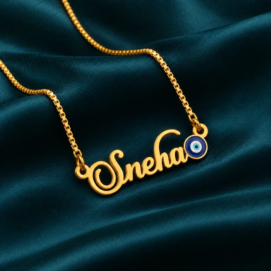 Blue Evil Eye Name Necklace - On dark green fabric Blue Evil Eye Name Necklace on dark green fabric